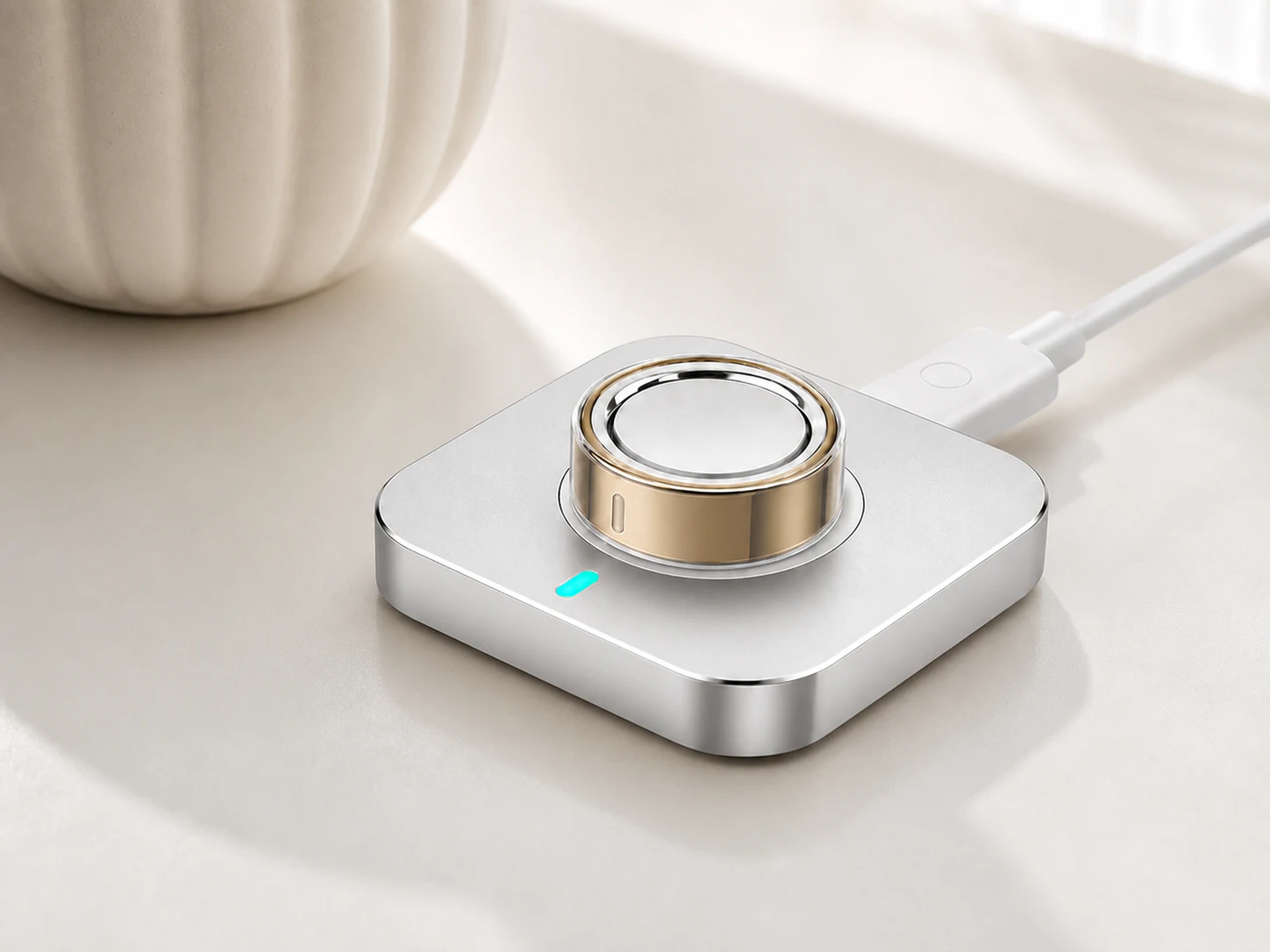 Oura Ring 5 charging while wearing a clear Sylacor cover